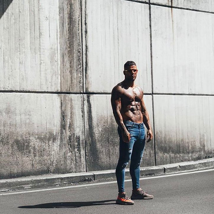 a man standing in front of a wall
