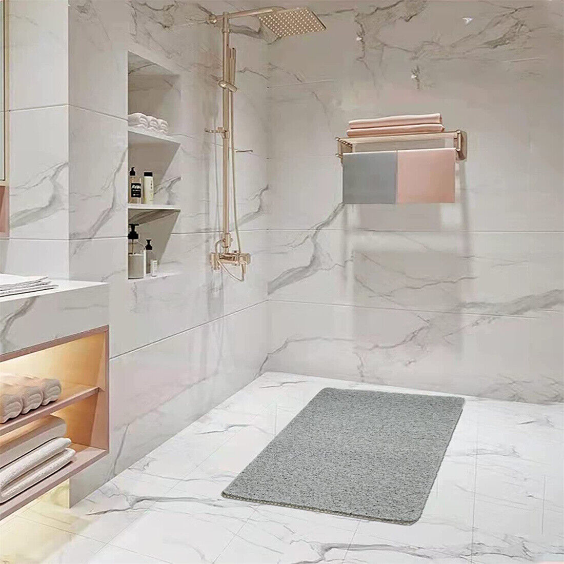 a bathroom with a shower and a rug