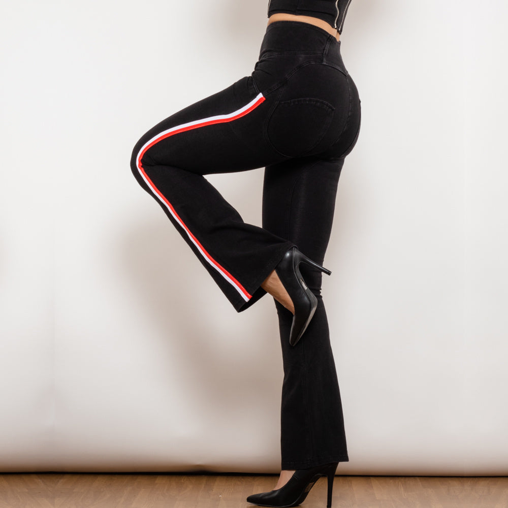 a woman wearing black pants and heels
