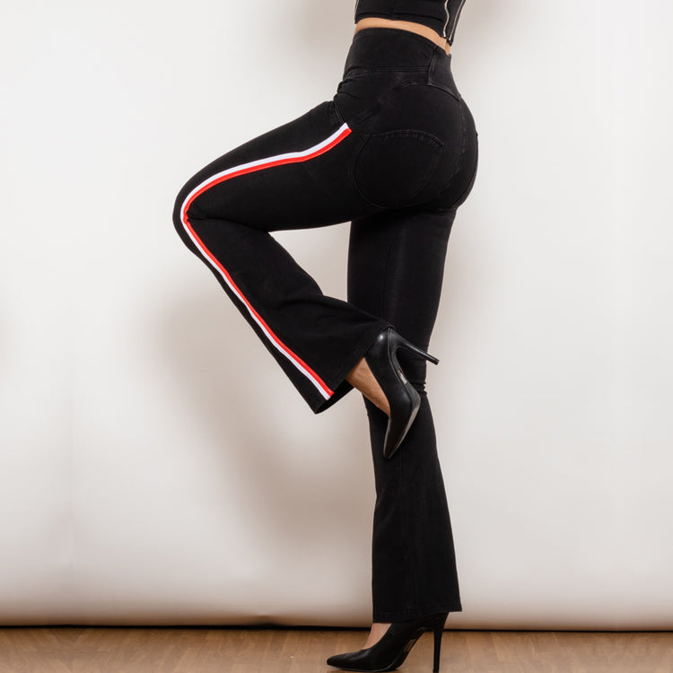 a woman wearing black pants and heels