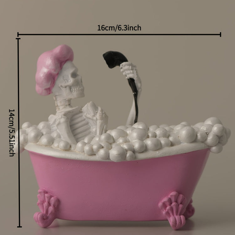 a small pink bathtub with a skeleton in it