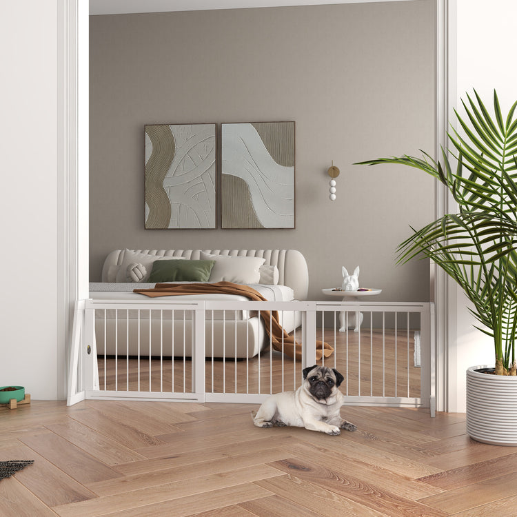 a dog lying on the floor in a room with a dog bed and a plant