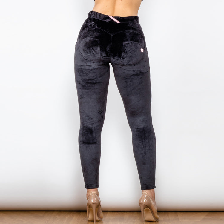 a woman wearing black pants