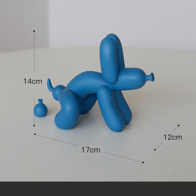 a blue balloon dog on a white surface