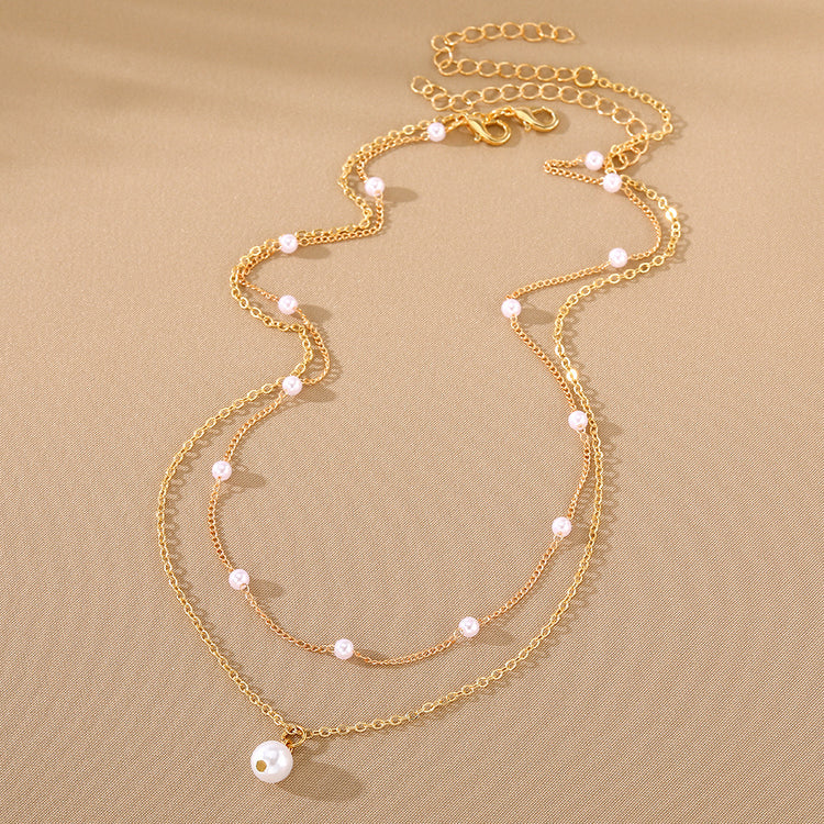 a necklace with pearls on it