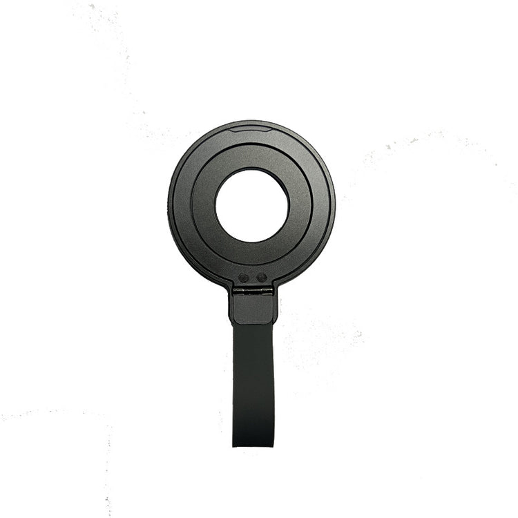 a black circular object with a strap
