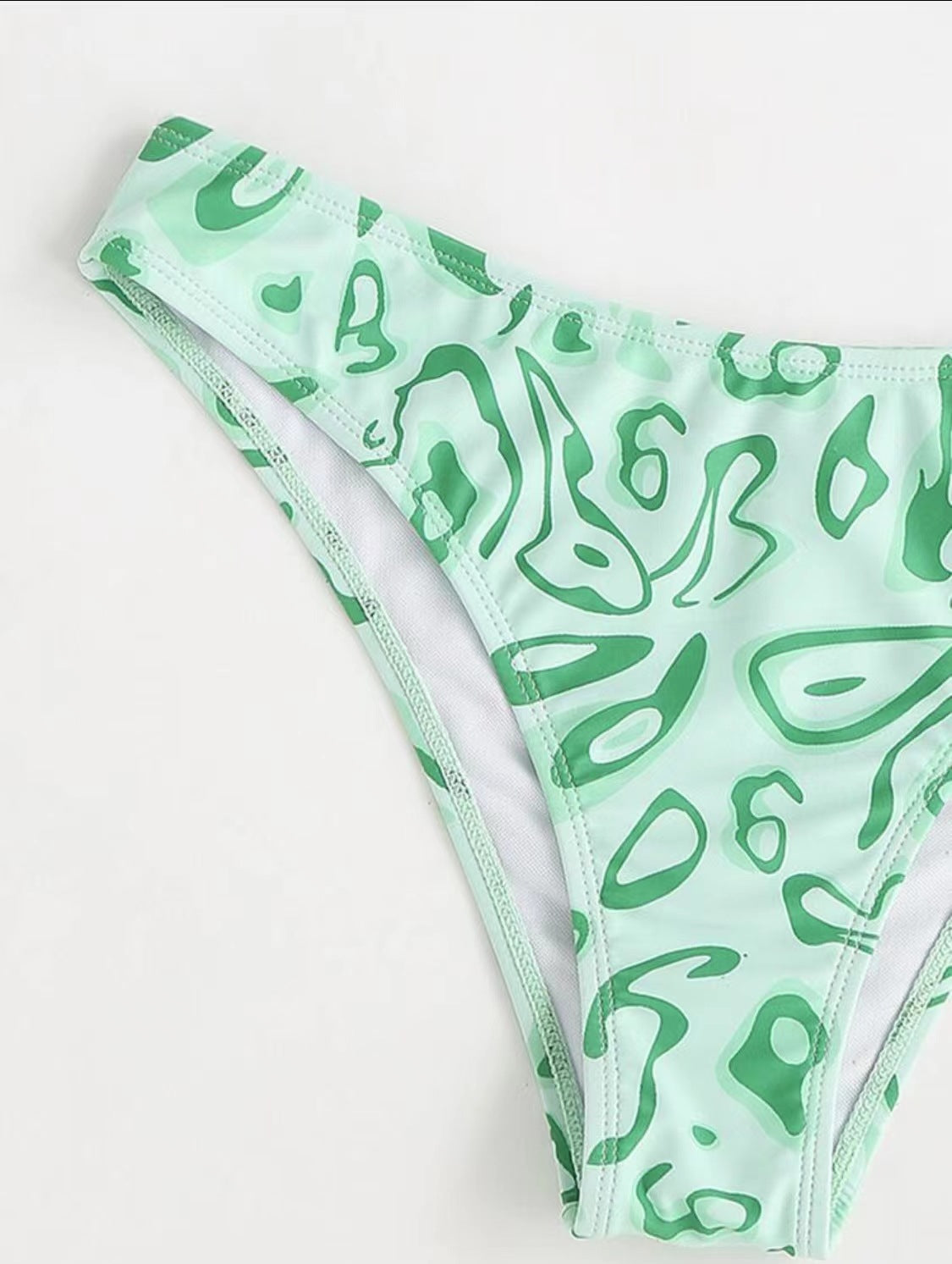 a green and white garment bottoms