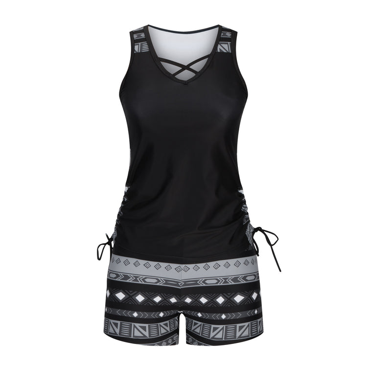 a black and grey tank top and shorts