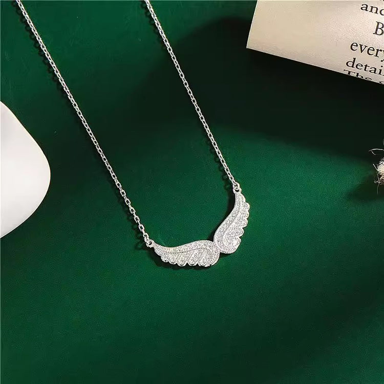 a necklace with a diamond pendant