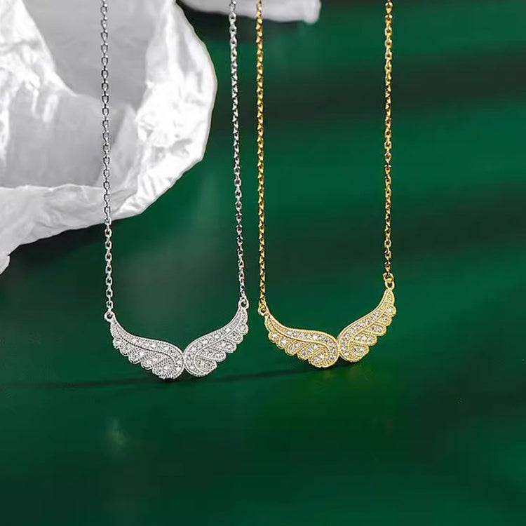 a pair of necklaces with wings