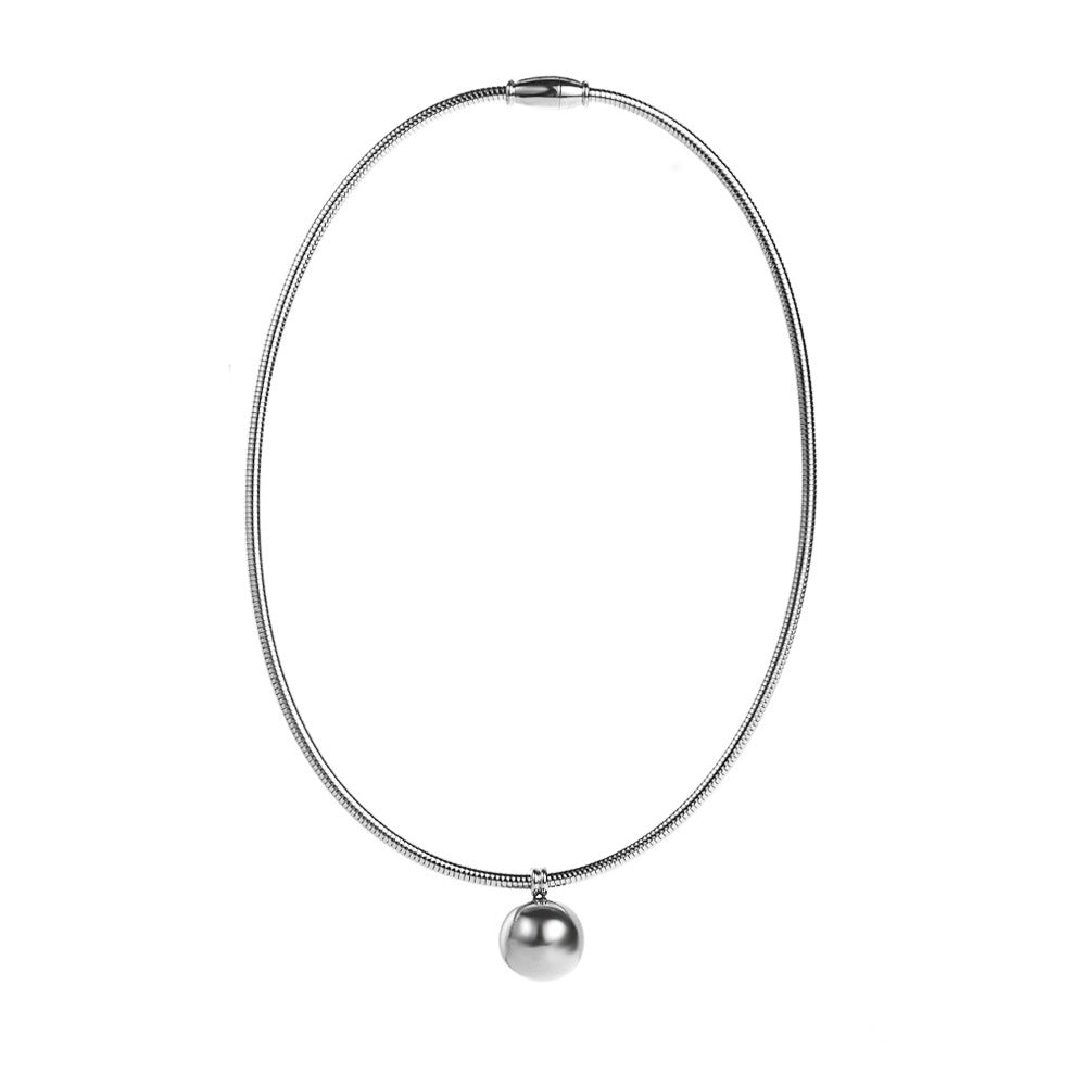 a silver necklace with a round pendant