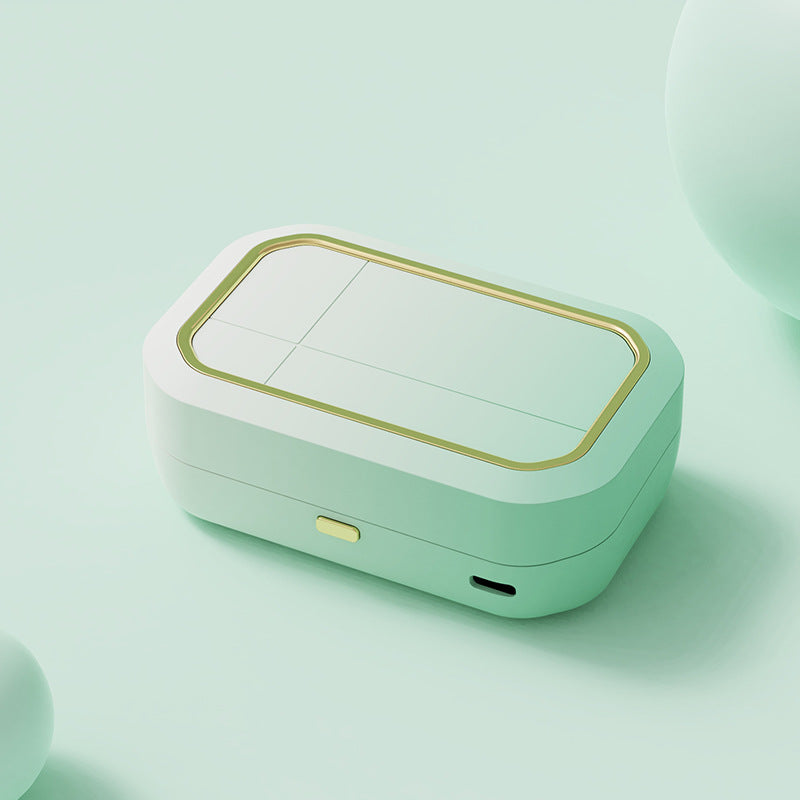 a white rectangular object with a gold border