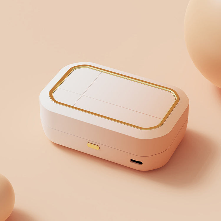 a white rectangular object with gold trim