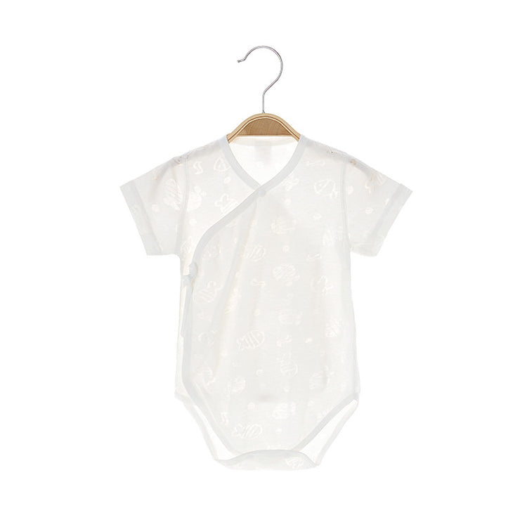 a white baby clothes on a swinger