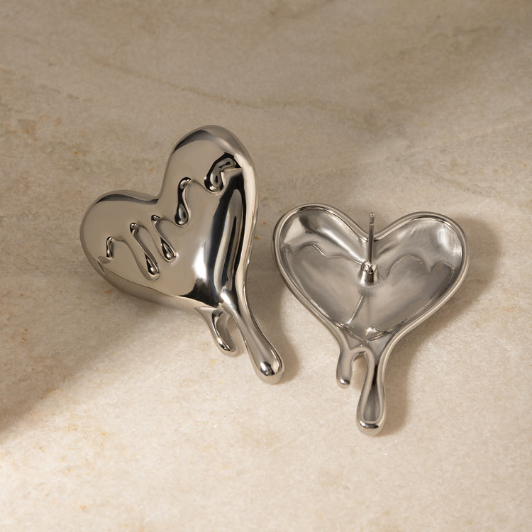 a pair of silver hearts