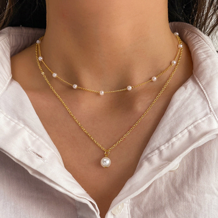 a woman wearing a necklace