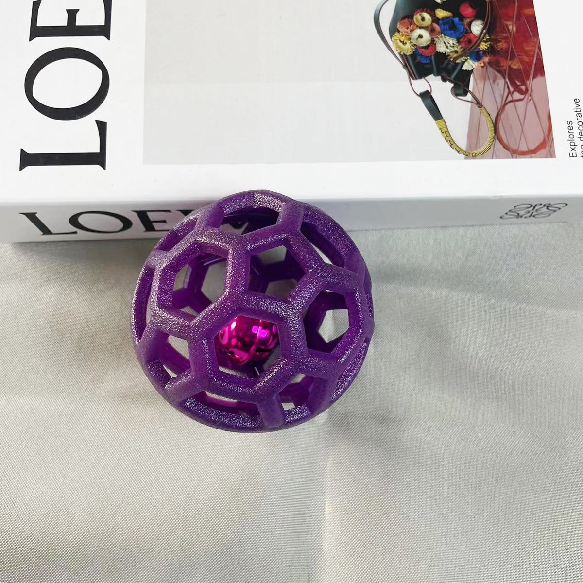 a purple ball next to a box