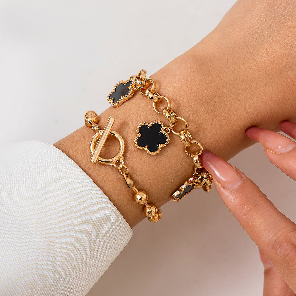 a person wearing a gold bracelet