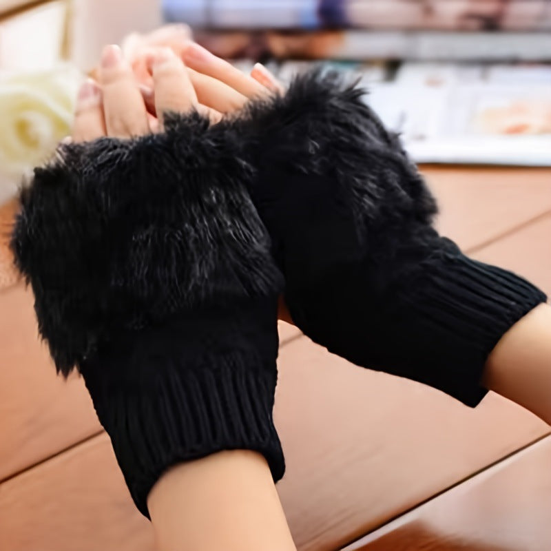 a pair of hands wearing black gloves