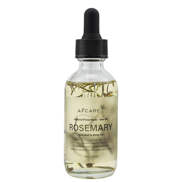 a bottle of oil with a dropper