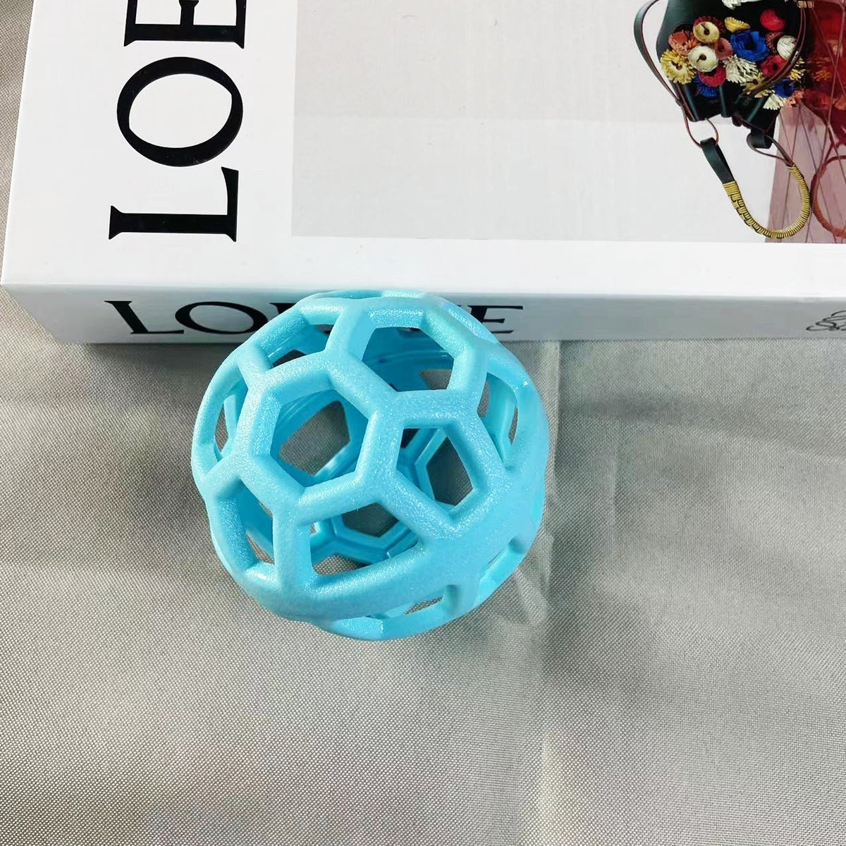 a blue ball next to a box