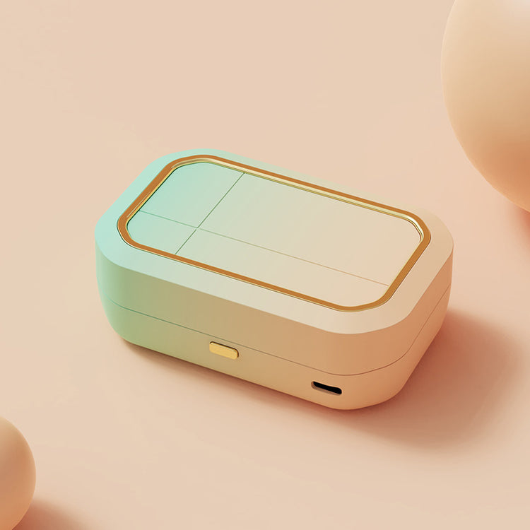 a white and green rectangular object with gold trim