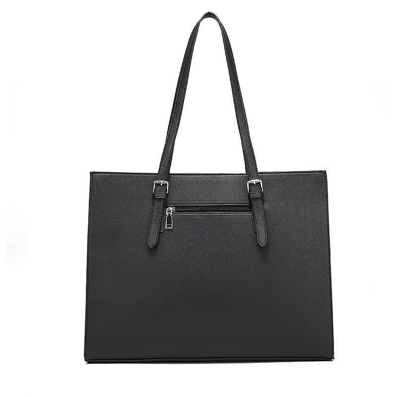 a black purse with a strap
