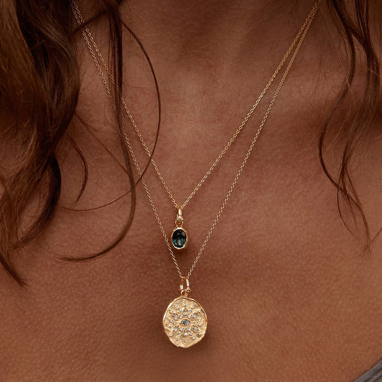 a woman wearing a necklace