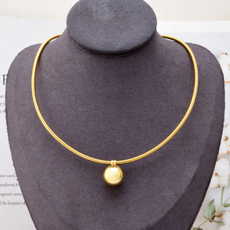 a necklace on a mannequin