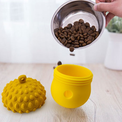 a bowl of food and a yellow container