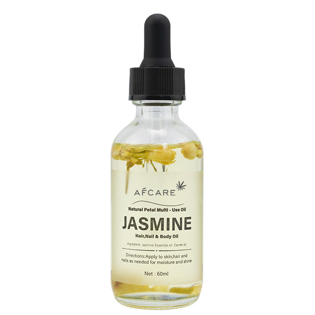 a bottle of oil with a black cap