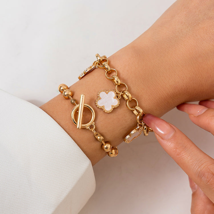 a person wearing a gold bracelet