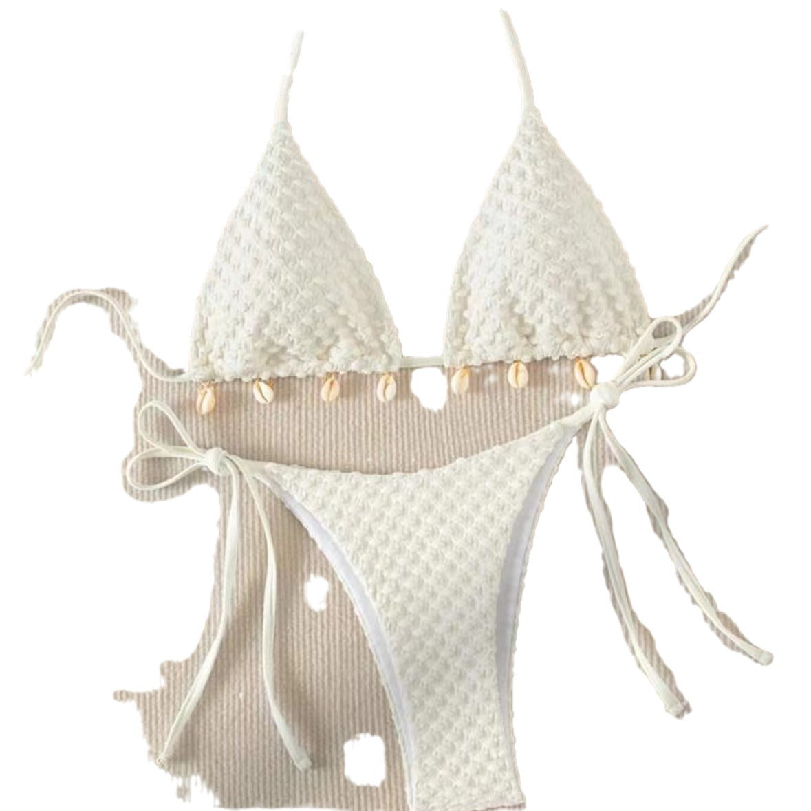 a white garment with shells on it