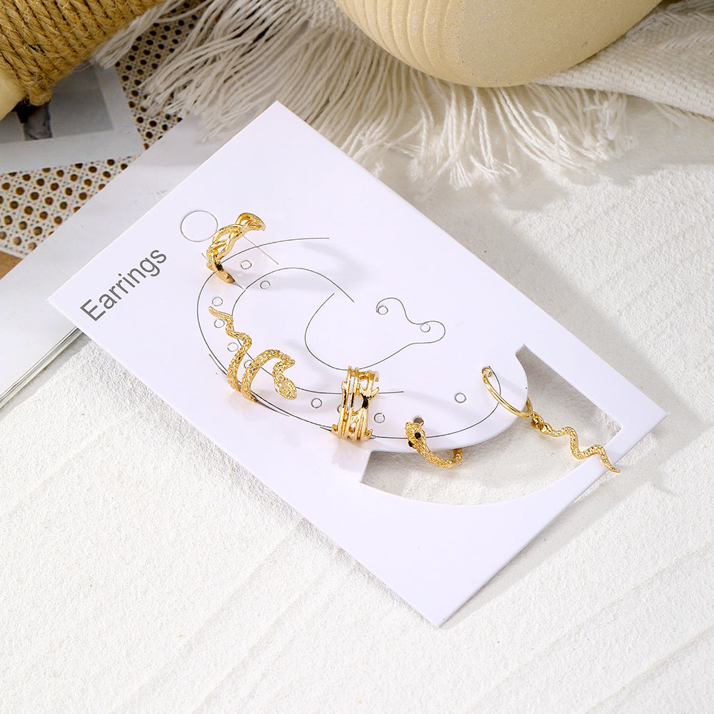 a gold earrings in a box