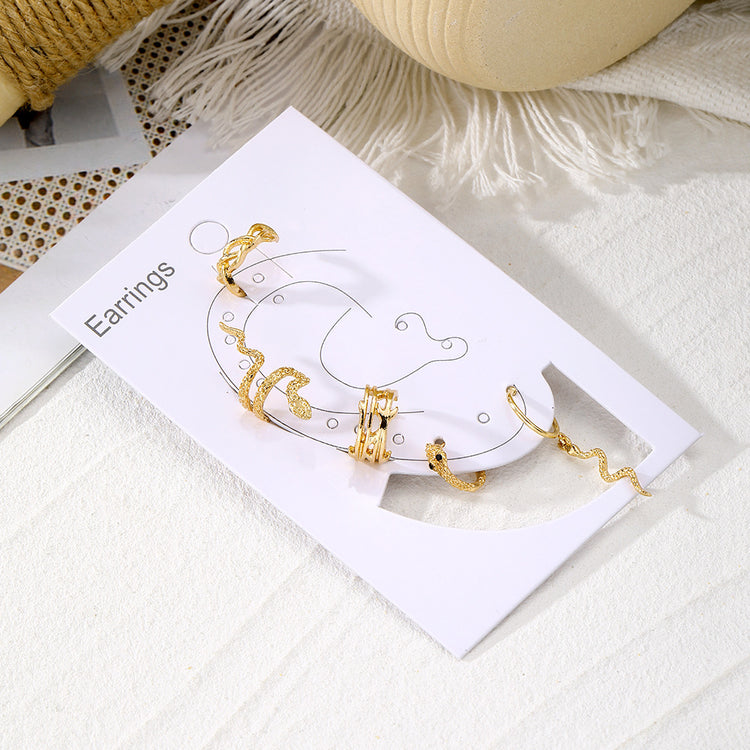 a gold earrings in a box