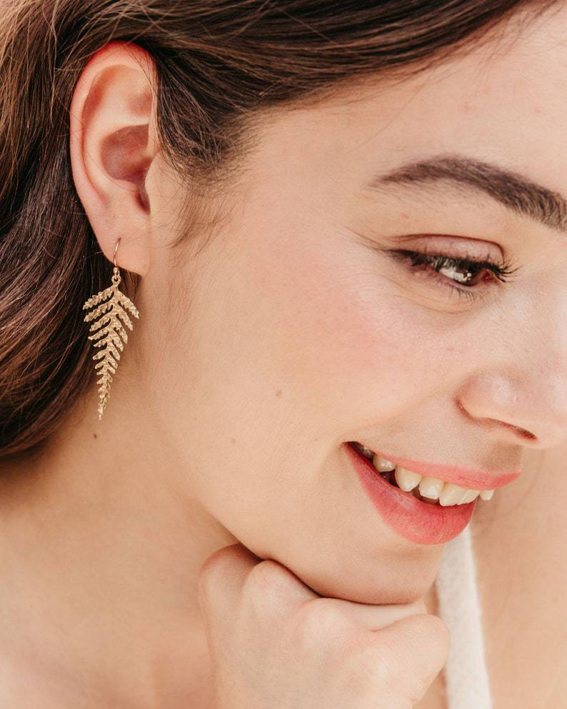 a woman with her hand under her chin