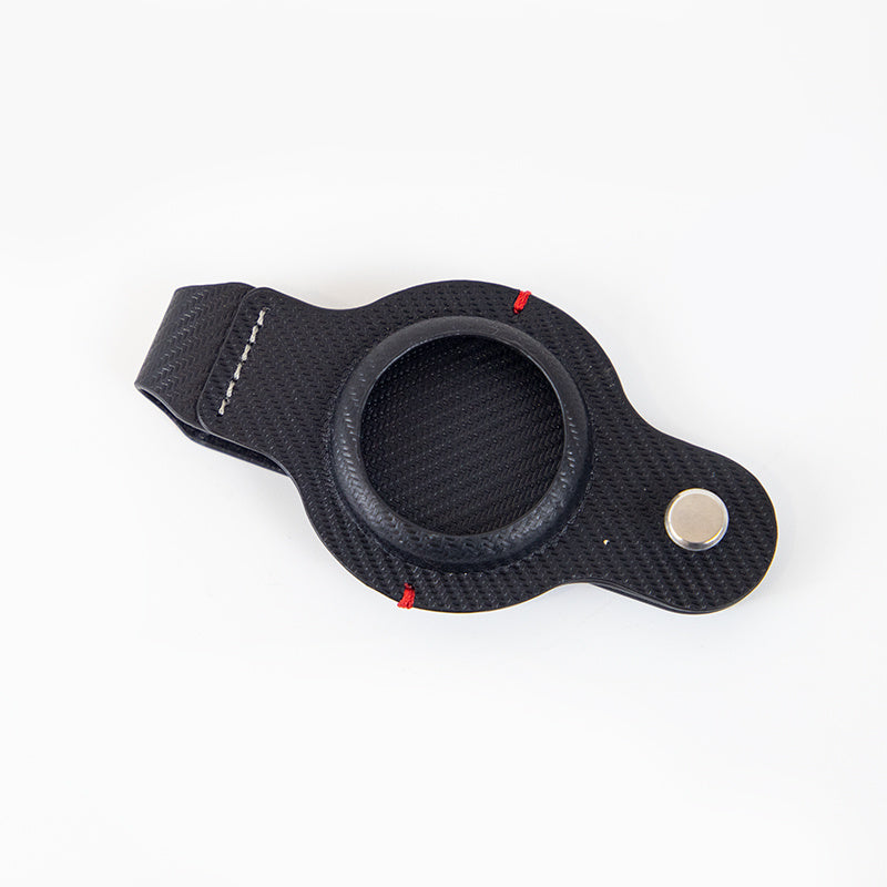 a black leather strap with a round hole