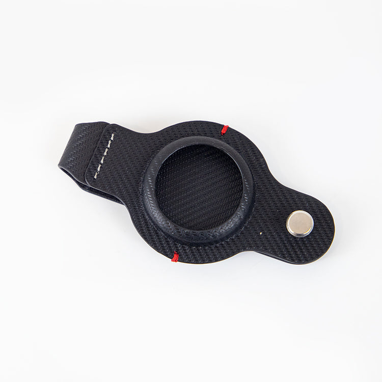 a black leather strap with a round hole