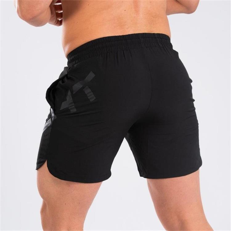 a man wearing black shorts