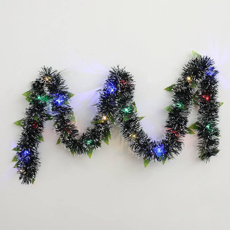 a black tinsel with lights on it