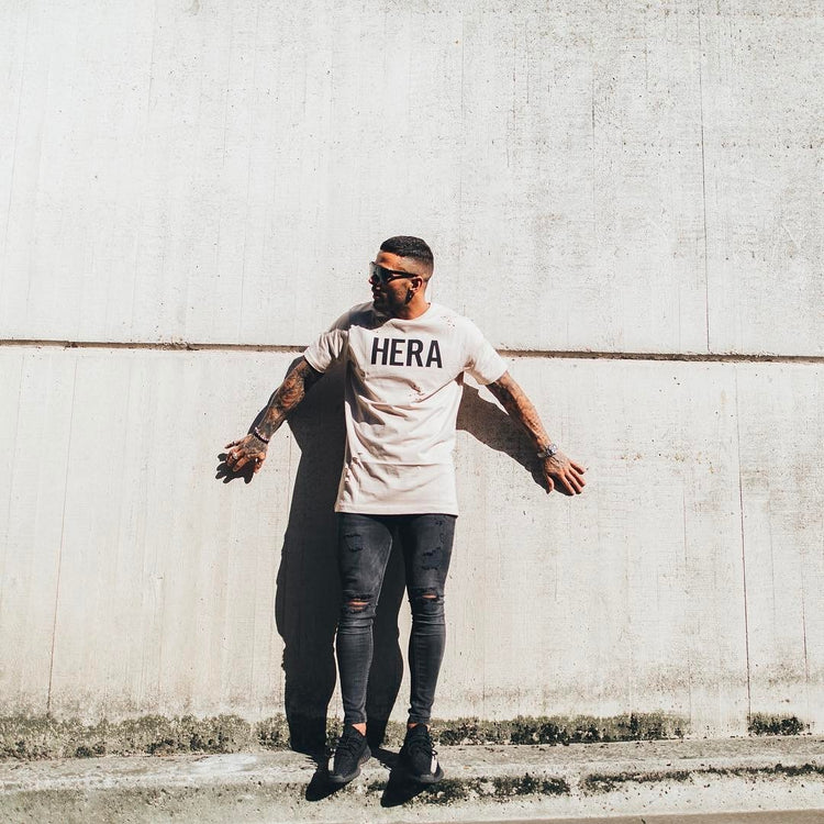 a man standing against a wall