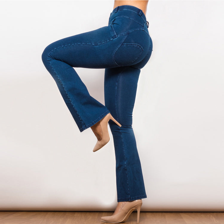 a woman wearing blue jeans and heels