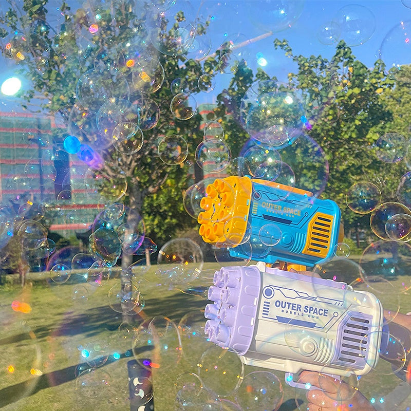 a hand holding a toy gun with bubbles in the air