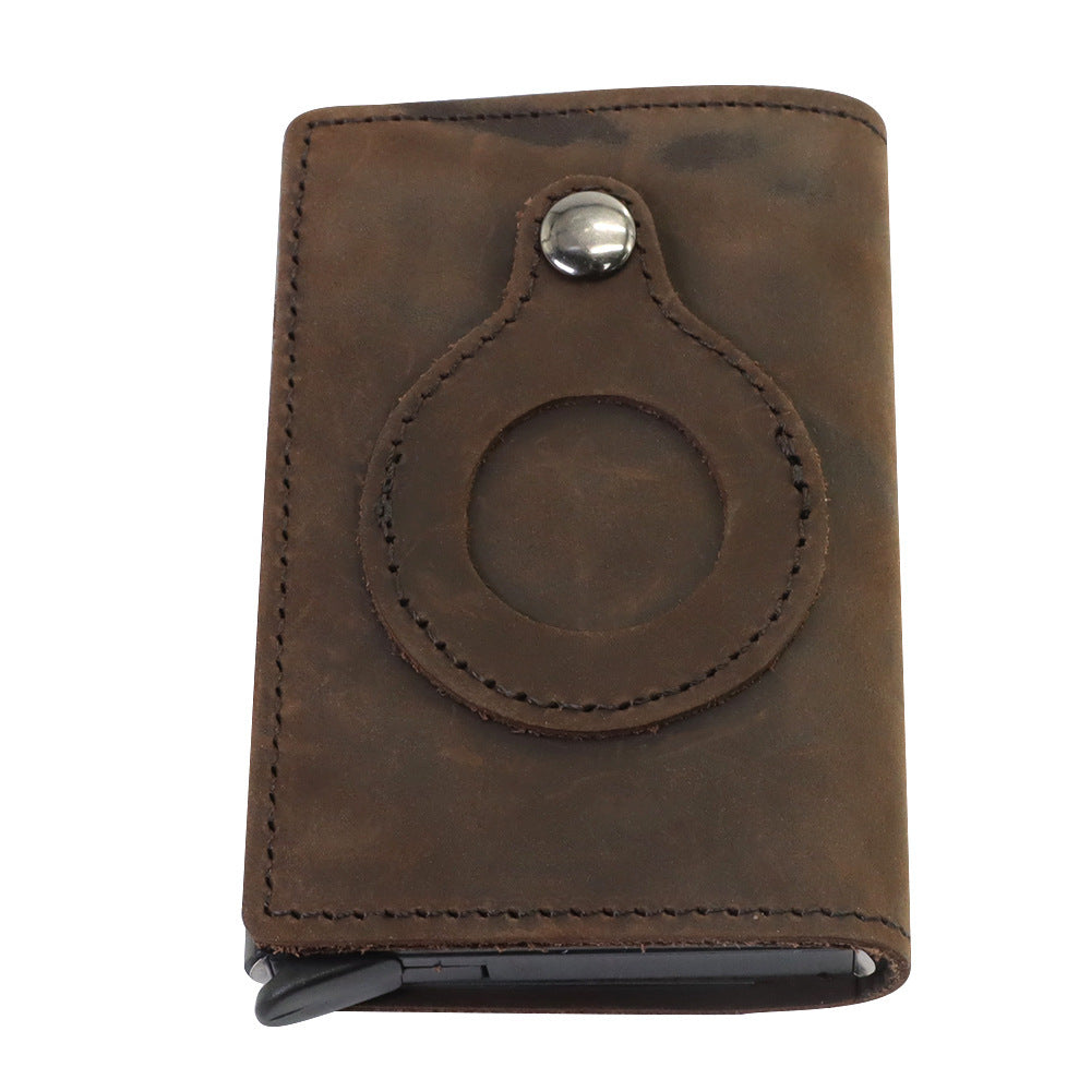 a brown leather wallet with a round design