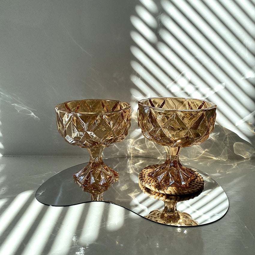 two glasses on a mirror