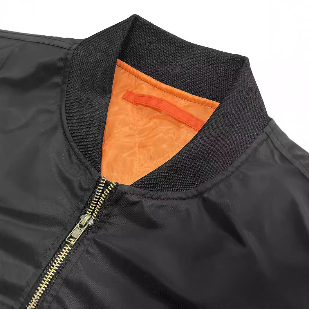 a black jacket with orange inside
