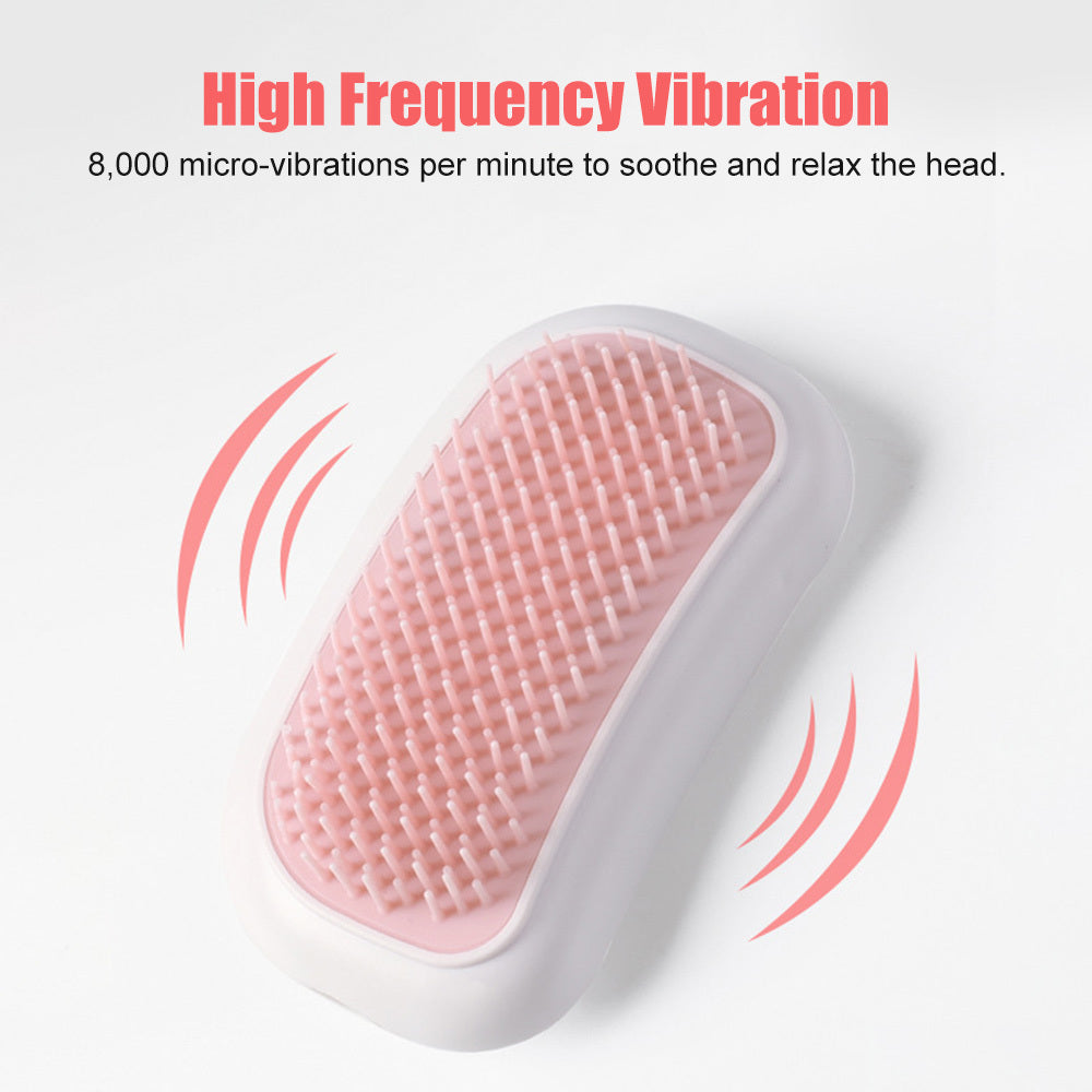 a pink and white massage brush