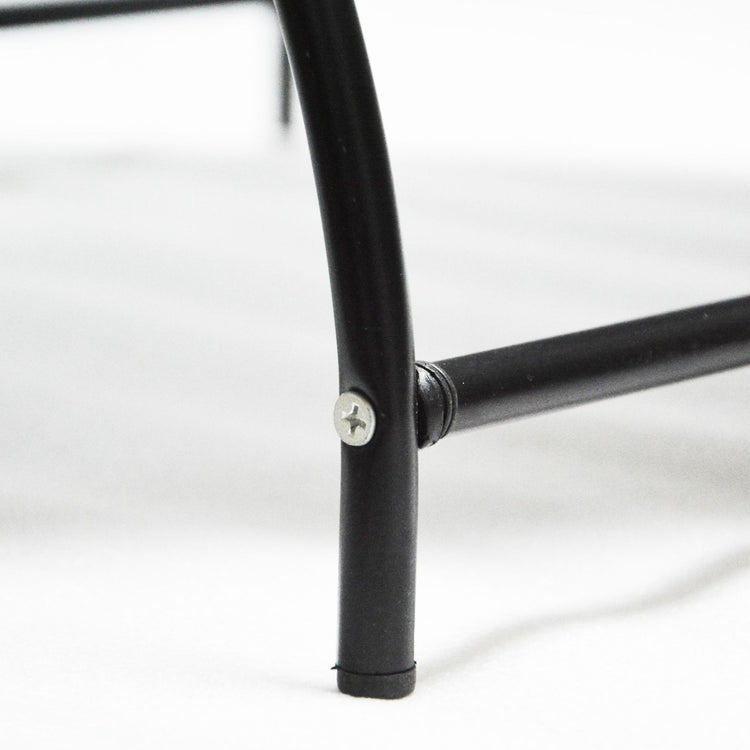 a close up of a black metal leg