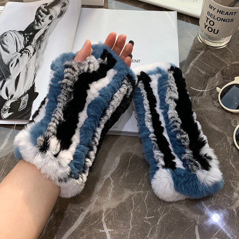 a pair of furry gloves on a table