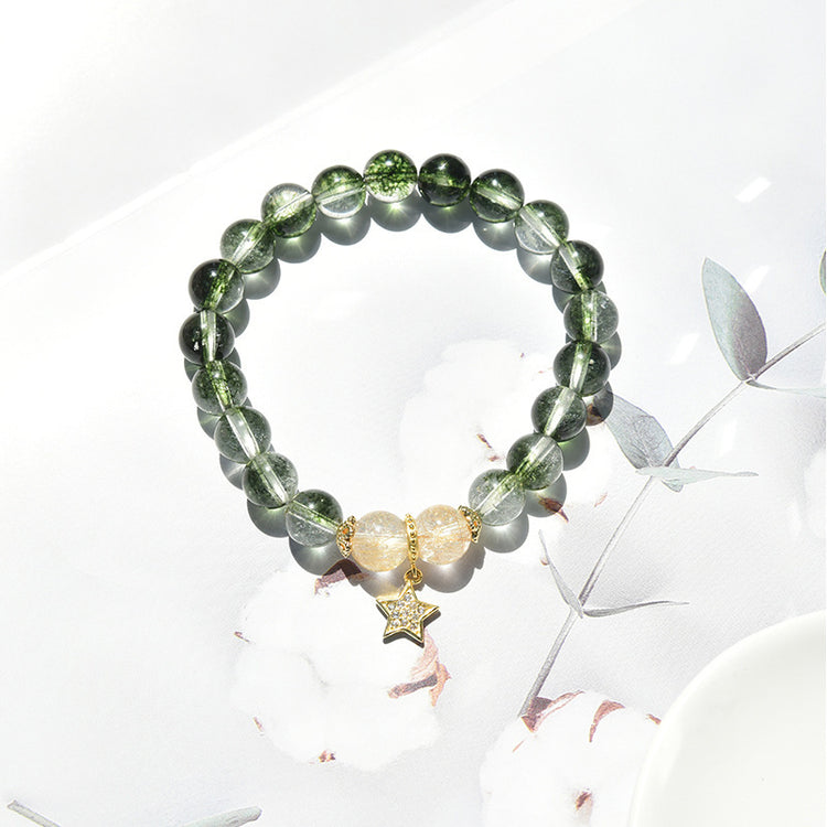 a bracelet with beads and a star charm